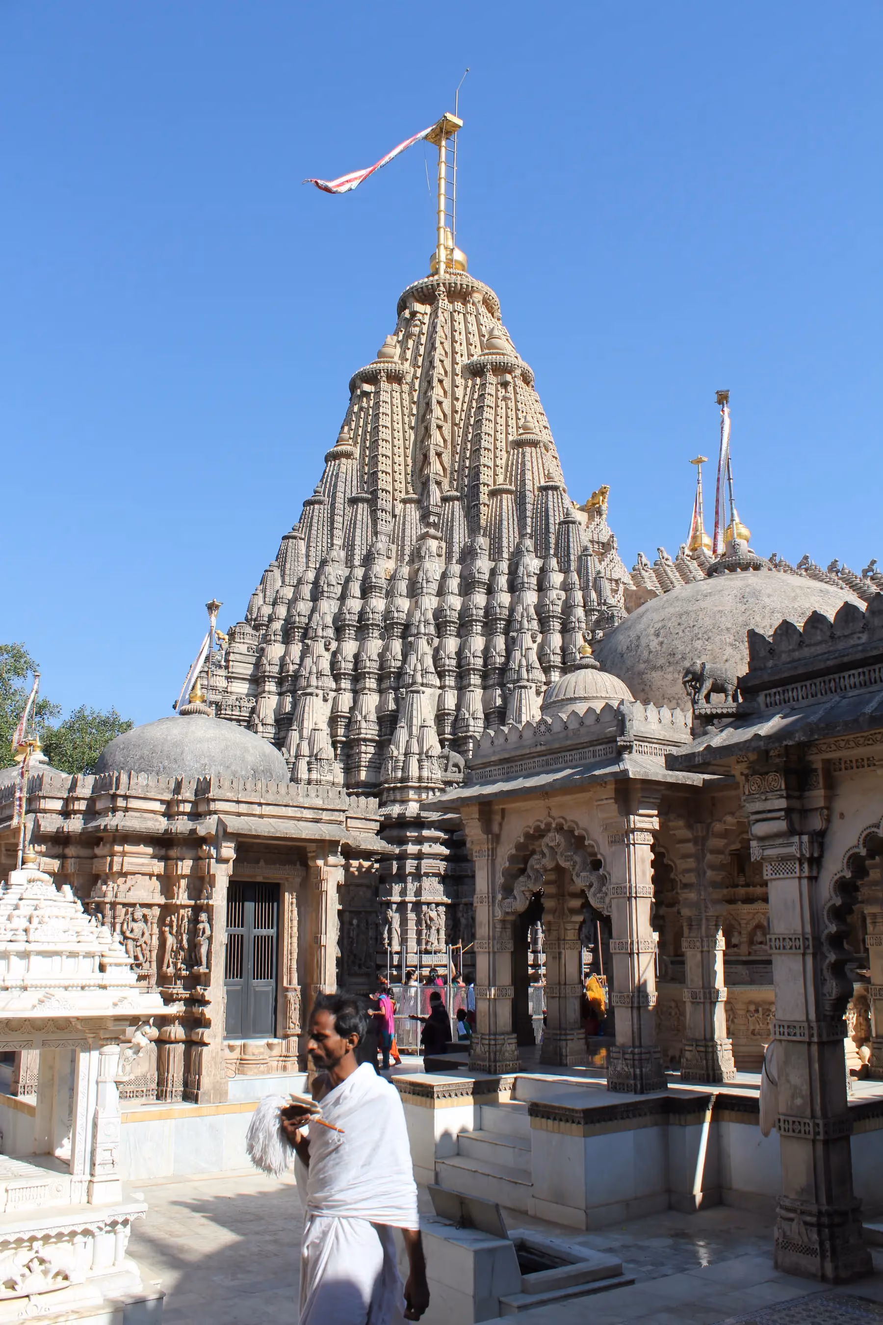 The carved stone shikhara of the Adishwar temple at Shatrunjaya rising above the temple walls at Palitana